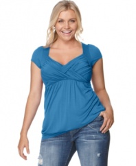 Soprano upgrades the cap sleeved plus size top with an enhancing crisscross front and slimming empire waist.