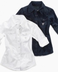 A long-sleeved, button-down shirt from Guess adds crisp, classic style to any outfit. (Clearance)