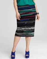 With a dramatic high waist silhouette in a shatter-stripe pattern, this ultra-stylish DKNYC midi skirt adds fashion-minded edge to your workweek look.