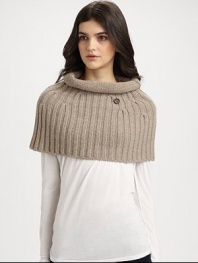 A plush, knit wool and cashmere topper with rolled collar in a cozy, cropped silhouette.About 15 X 1770% wool/30% cashmereDry cleanMade in Italy