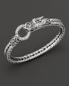Eastern elements inform John Hardy's dragon head bracelet. It features a polished silver link band and dragon head clasp with round white topaz clasp.