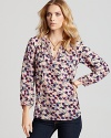Rebecca Taylor re-imagines the floral print, mixing daisies with playful polka dots atop luxe silk.