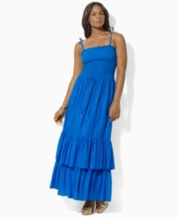 Rendered in airy cotton voile for a full, floaty silhouette, Lauren by Ralph Lauren's graceful plus size maxi dress is designed with a flattering smocked bodice and a two-tiered ruffled hem for whimsical appeal.