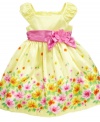Tip toe through the flowers. She'll be the prettiest pick of the bunch in this sunny border print dress from Nannette.