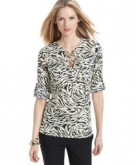 MICHAEL Michael Kors' sophisticated animal print is just the thing to pair with the season's colorful, skinny pants. Flap pockets at the chest and a drawstring neckline give an air of utility-chic. (Clearance)