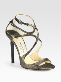 Shimmering metallic leather forms this iconic strappy silhouette with a lustrous high-heel. Lacquered heel, 4½ (115mm)Metallic leather upperAdjustable ankle strapsLeather lining and solePadded insoleMade in ItalyOUR FIT MODEL RECOMMENDS ordering one half size up as this style runs small. 