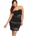 Take your style to the hottest level with Trixxi's strapless plus size dress, featuring ruched and lace tiers.