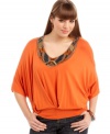 Get Carnival-inspired style with ING's dolman sleeve plus size top, accented by a beaded neckline.