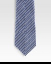 An elegant look handmade with diagonal stripes in fine Italian silk. Silk Dry clean Made in Italy 