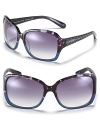 Fall in love with these oversized two-color sunglasses with silvertone glitter heart embellishments along arms.