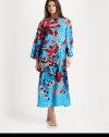 A bold abstract print covers this long silhouette, perfect for layering with your favorite pieces. Pull-over styleMandarin collarLong sleevesAbout 52 from shoulder to hemPolyesterMachine washImported