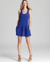 A high-voltage hue amps up this Juicy Couture tank dress. Team with a strappy neon bikini and hit the beach.