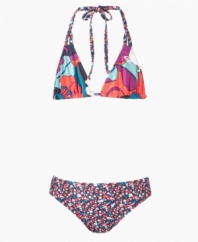 Tropical trends. She'll love the exotic floral prints on this two-piece swimsuit from Roxy, perfect for sunny fun on the sand.