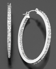 Dazzling diamond accents line these brilliant hoop earrings inside and out. Crafted in 14k white gold. Approximate diameter: 1 inch.
