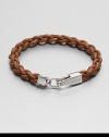 A braided strand of genuine leather is offset by a shiny, sterling silver clasp.LeatherSterling silverAbout 2½ diam.Made in the United Kingdom
