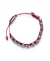 Edgy, with a feminine undertone. Ali Khan's silver-plated mixed metal bracelet features several tiny skulls along a fuchsia-colored cord. Bracelet is fully adjustable. Approximate length: 12 inches. Approximate diameter: 2 inches.