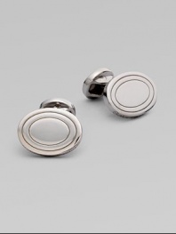 Polished ovals of sterling silver add a tailored touch to shirt cuffs.Sterling silver About ¾ X ½L Made in the United Kingdom