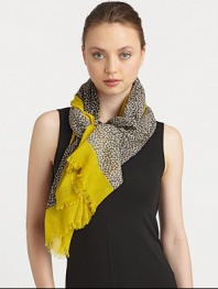 An animal print style with a solid border in lightweight wool. WoolAbout 68 X 40Dry cleanImported 