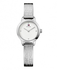 Stamped logos accent the sophisticated steel of this bracelet watch by Tommy Hilfiger. Logo-embossed stainless steel bangle bracelet and round case. Silver tone dial features dot markers at twelve, three, six and nine o'clock, two hands and logo. Quartz movement. Water resistant to 30 meters. Ten-year limited warranty.