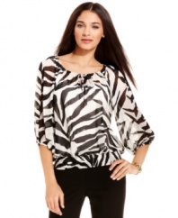 Alfani jazzes up a petite peasant-style blouse with a modern zebra print! Create a variety of outfits by pairing this pretty top with skirts, pants and jeans.