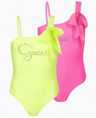 Fun in the sun. She'll be ready to play in this colorful, sequined one-piece swimsuit from Guess.