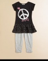 She'll fall in love with this alluring set featuring an ultra-soft tunic with peace sign, crinkle chiffon tiered hem and matching leggings. Tunic CrewneckShort cuffed sleevesPullover styleDrop waistRuffled hem Leggings Elastic waistbandAnkle snapsTunic: 95% polyester/5% spandexLeggings: 95% cotton/5% spandexMachine washImported Please note: Number of buttons may vary depending on size ordered. 