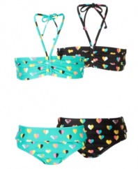 Put her heart into it. She'll enjoy the sun and sand with all she has in this adorable bandeau bikini from Roxy.