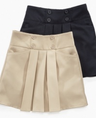 Adorable accents. Pretty pleats and cute button detailing on this uniform scooter from Nautica make it a lovely look for school days.