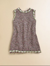 A sophisticated sheath for a chic young lady in a chunky, multicolor tweed with twisted braid trim and a bold back zipper.Round fringed neckline with braided trimSleeveless with fringed, braided trimSlightly fitted through the waistBold contrast back zipperFringed and braided hemSilk lining51% rayon/39% cotton/8% nylon/2% acetateDry cleanImported