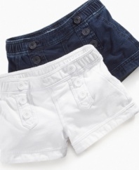 Button up her cool, casual style with these versatile shorts from Guess.