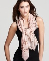 Flocks of birds and floral print decorate this elegant woven scarf from Fraas.