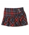 Hip. An asymmetrical cut gives a twist to the traditional plaid that decorates this stylish skirt from BCX.