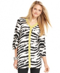 This chic petite tunic from Alfani features a bold animal print that's highlighted by a flash of contrasting trim at the neck and center front.