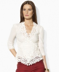 Steeped in vintage inspiration, Lauren by Ralph Lauren's delicate petite wrap top is rendered in woven cotton and accented with lace detailing along the neckline, cuffs and hem.