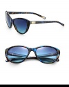 A feminine cat's-eye design is ultra-versatile and lightweight in acetate. Available in black with smoke gradient lens or flame blue with blue gradient lens. Metal logo plaque templesUV400 protectionMade in Italy 