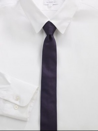 A simplistic design woven in smooth Italian silk.About 2 wideSilkDry cleanMade in Italy