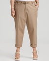Put a summery spin on classic khakis in Calvin Klien's rolled cuff pants. Feminine heels elongate the silhouette.