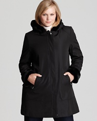 Plush faux fur lining lends supple warmth to this hooded A-line coat by Marc New York.