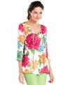Create a lively ensemble with this Charter Club tunic, featuring a gorgeous floral print and flattering silhouette. It's perfect for wearing on a beachy vacation, too! (Clearance)