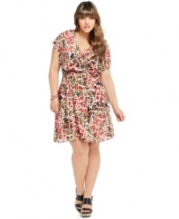 Spotlight fierce style this season with American Rag's short sleeve plus size dress, featuring a bold animal print.