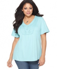 An embroidered neckline adds a charming feel to Karen Scott's short sleeve plus size top-- pair it with the season's latest casual bottoms.