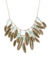 Birds of a feather will flock to this fashionable trend. Lucky Brand's bold bib necklace features a two-row design combining detailed feather charms and pale green epoxy beads. Set in gold tone mixed metal. Approximate length: 18 inches. Approximate drop: 2-5/8 inches.
