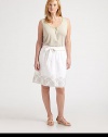 You will instantly fall in love with the elegant embroidery on this linen skirt. Its flared silhouette offers a flattering fit as its contrast piping completes this feminine look.Contrast piping at waistbandGrosgrain self-tie beltPleat details at waistSlash pocketsHook-and-eye closureEmbroidered hemConcealed back zipperAbout 22 longLinenDry cleanImported