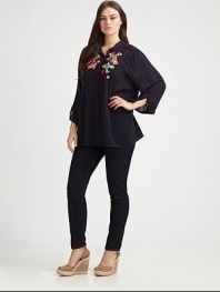Pretty floral embroidery perfectly complements this feminine design. There is no doubt that this relaxed-fit top would be a welcomed addition to your wardrobe.Split neckLong sleevesEmbroidered detailsAbout 32 from shoulder to hemRayonMachine washImported