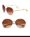Timeless sunglasses in a retro rimless design with requisite logo temples. Available in bronze with brown gradient lens or black with grey gradient lens.Gold-tone metal logo templesUV400 protectionMade in Italy 