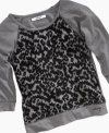 Wild and cozy kids. She can wrap up in the cute comfort of this animal print popover shirt from DKNY.