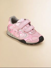 Designed for your little girl on-the-go, these eye-catching, sparkly sneaks light-up while she walks, plus feature patented, breathable technology that absorbs and expels sweat, while keeping out water.Double grip-tape closureTextile upperTextile liningRubber solePadded insoleImported