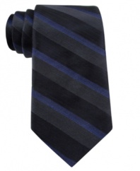 With a subtle blend of colors, this Calvin Klein striped skinny tie makes a solid statement.