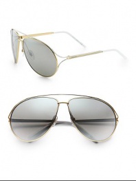 A cool, classic aviator design in lightweight metal. Available in gold-black with grey gradient lens or gold-white with silver gradient lens. Metal logo temples100% UV protectionMade in Italy