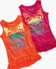 Fun fluttery fashion. Ruffles line the hem of this lightweight tank from Guess, perfect for her summer style.